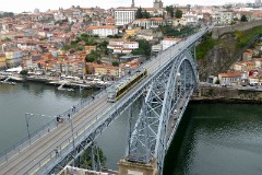 Metro do Porto Bombardier Flexity-Outlook tram (line D) at Ponte Luís (crossing Rio Douro), 16. October 2016.  To the right beneath the bridge you see the Funicular dos Guindais.