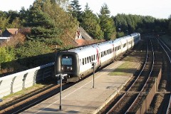 Ic3 trainset MFA 5064/MFB 5264 (named C.W. Obel) photographed in Børkop 16. October 2005.  The Ic3 was built by ABB Scandia in Denmark. Each unit consists of 3 coaches. Built in a number of 92 trainsets. The trainsets were put in service in 1989 - 1998. 4 diesel engines of 294 kW per trainset. Max speed 180 km/h - 112 mph. Length 58 800 mm. Weight 97 metric tonnes. 16 seats 1st class, 128 seats 2nd class. Up to 5 trainsets can be put together. The MFA 5064/MFB 5264 was put in service in 1992.