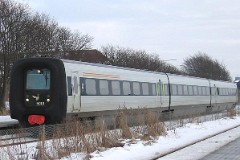 Ic3 trainset MFA 5019/MFB 5219 (named Jeppe Aakjær) photographed in Aalborg Vestby 28. January 2006.  The Ic3 was built by ABB Scandia in Denmark. Each unit consists of 3 coaches. Built in a number of 92 trainsets. The trainsets were put in service in 1989 - 1998. 4 diesel engines of 294 kW per trainset. Max speed 180 km/h - 112 mph. Length 58 800 mm. Weight 97 metric tonnes. 16 seats 1st class, 128 seats 2nd class. Up to 5 trainsets can be put together. The MFA 5019/MFB 5219 was put in service in 1990.