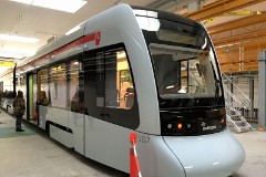 Stadler Tango, photographed at the work shop of Midttrafik in Aarhus, 8. October 2016.  This type will be delivered in a number of 12 . It has a maximum speed of 100 km/h. The new tram line is supposed to be ready for operation in 2017. The tram line transforms two existing railways - Odderbanen and the Grenaa railway - to an electric light rail. The two lines will be connected via a new track from Lystrup, Skejby, Randersvej, the urban harbor and Aarhus Central Station.